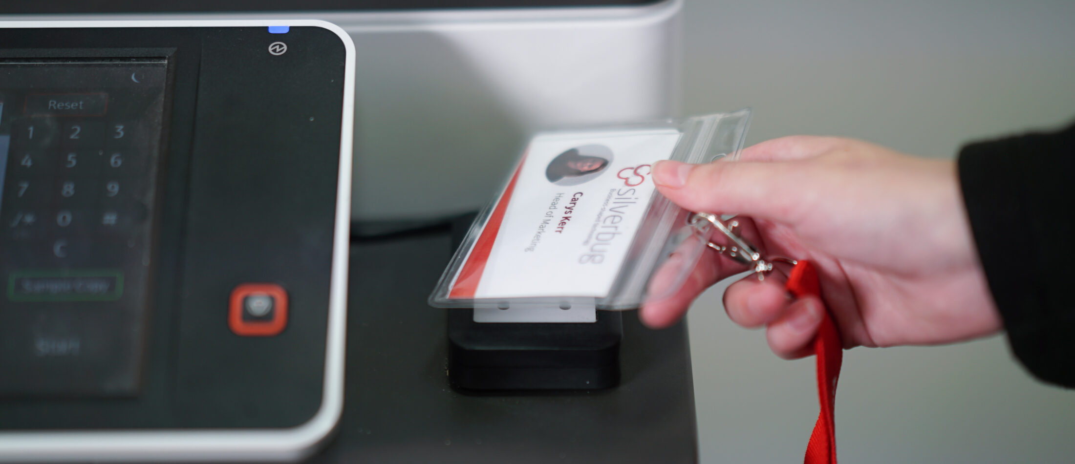 ID badge being scanned on a printer