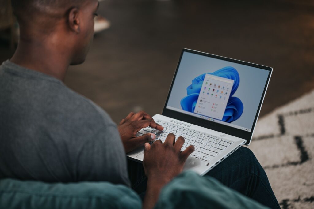 Man using a Microsoft Laptop